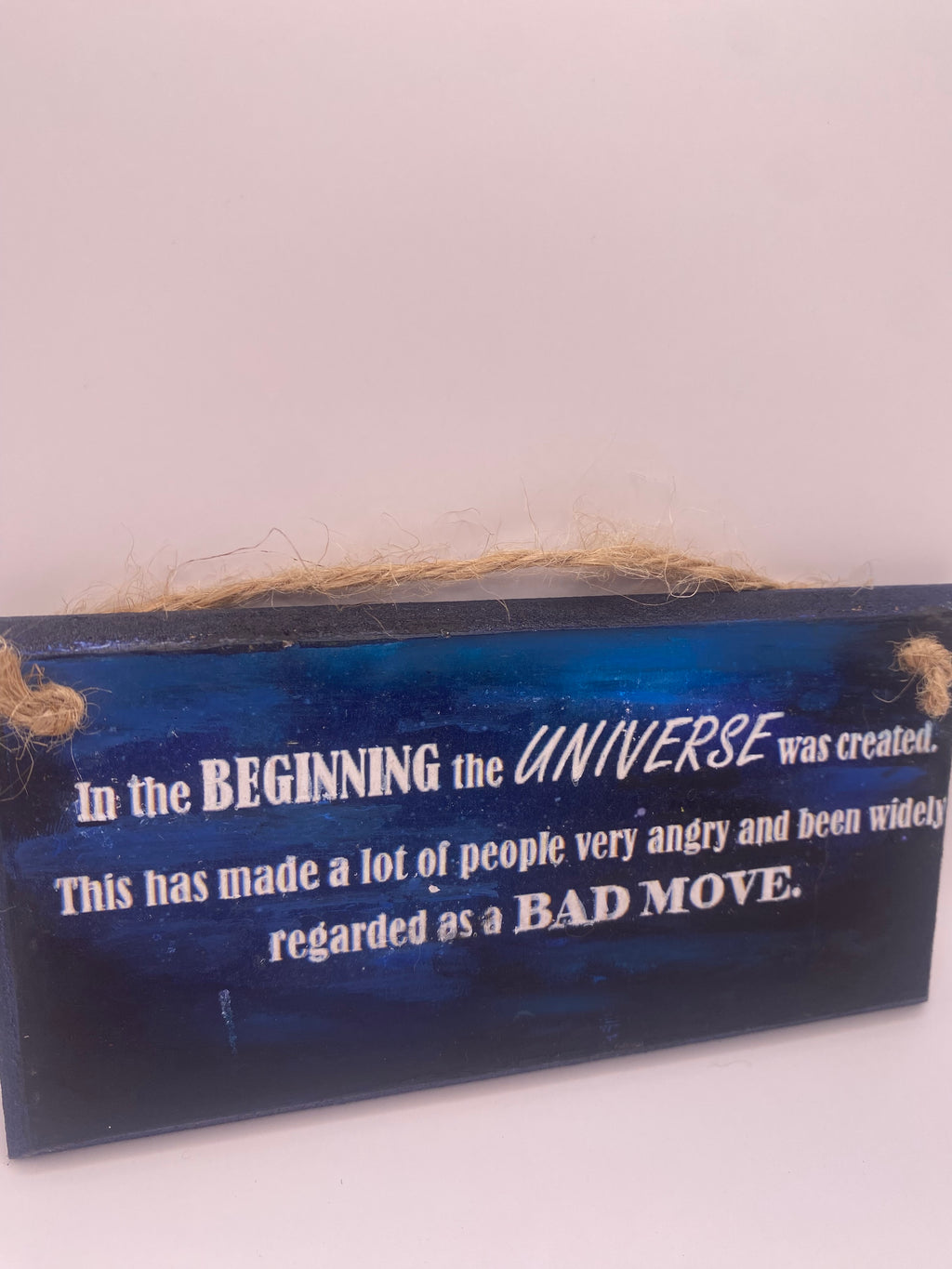 Hand‑Painted Wooden Plaque – “In the beginning the universe was created..." Douglas Adams inspired literary sign (6x3", 7x4”, 8x4”)