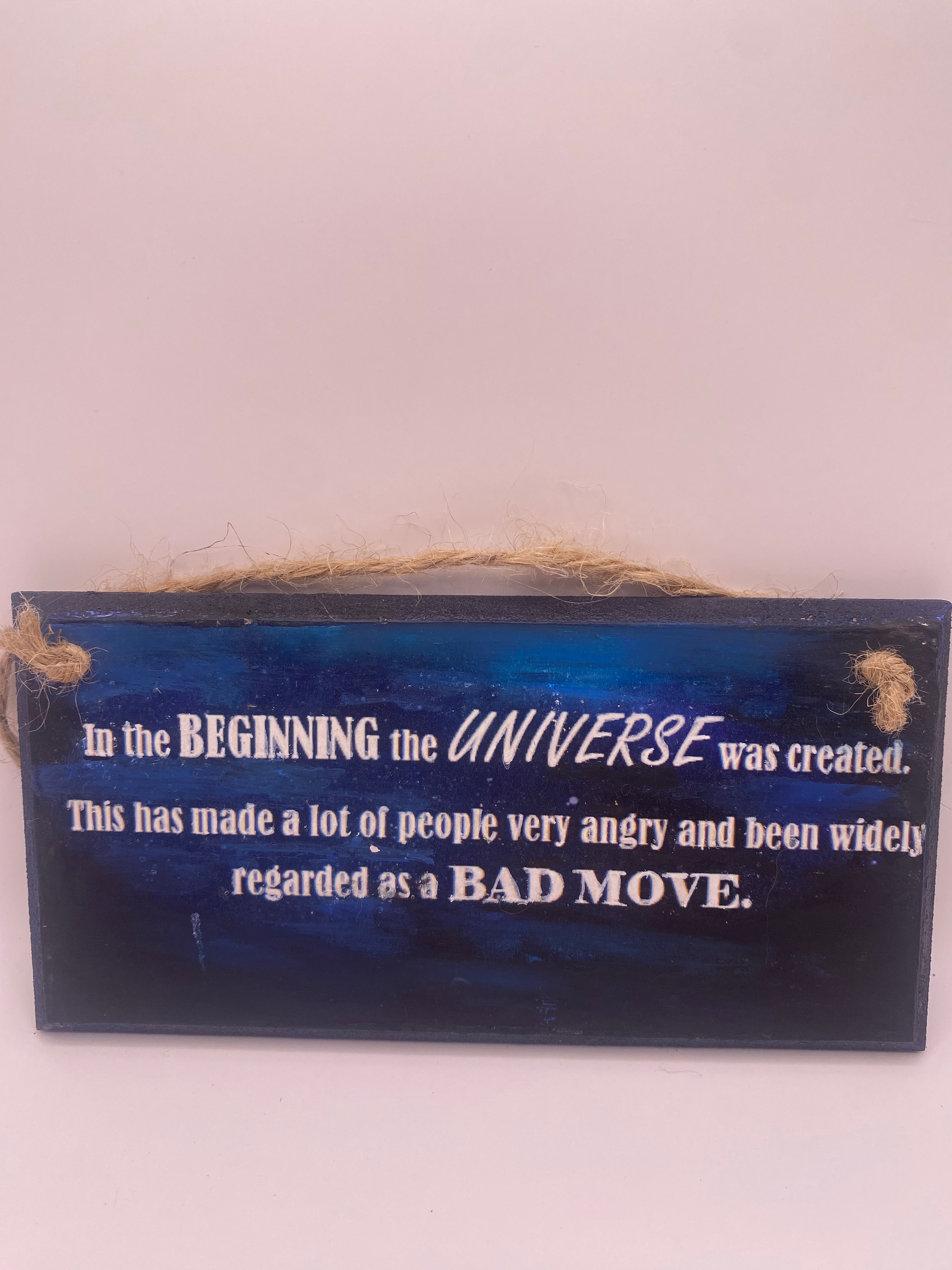 Hand‑Painted Wooden Plaque – “In the beginning the universe was created..." Douglas Adams inspired literary sign (6x3", 7x4”, 8x4”)