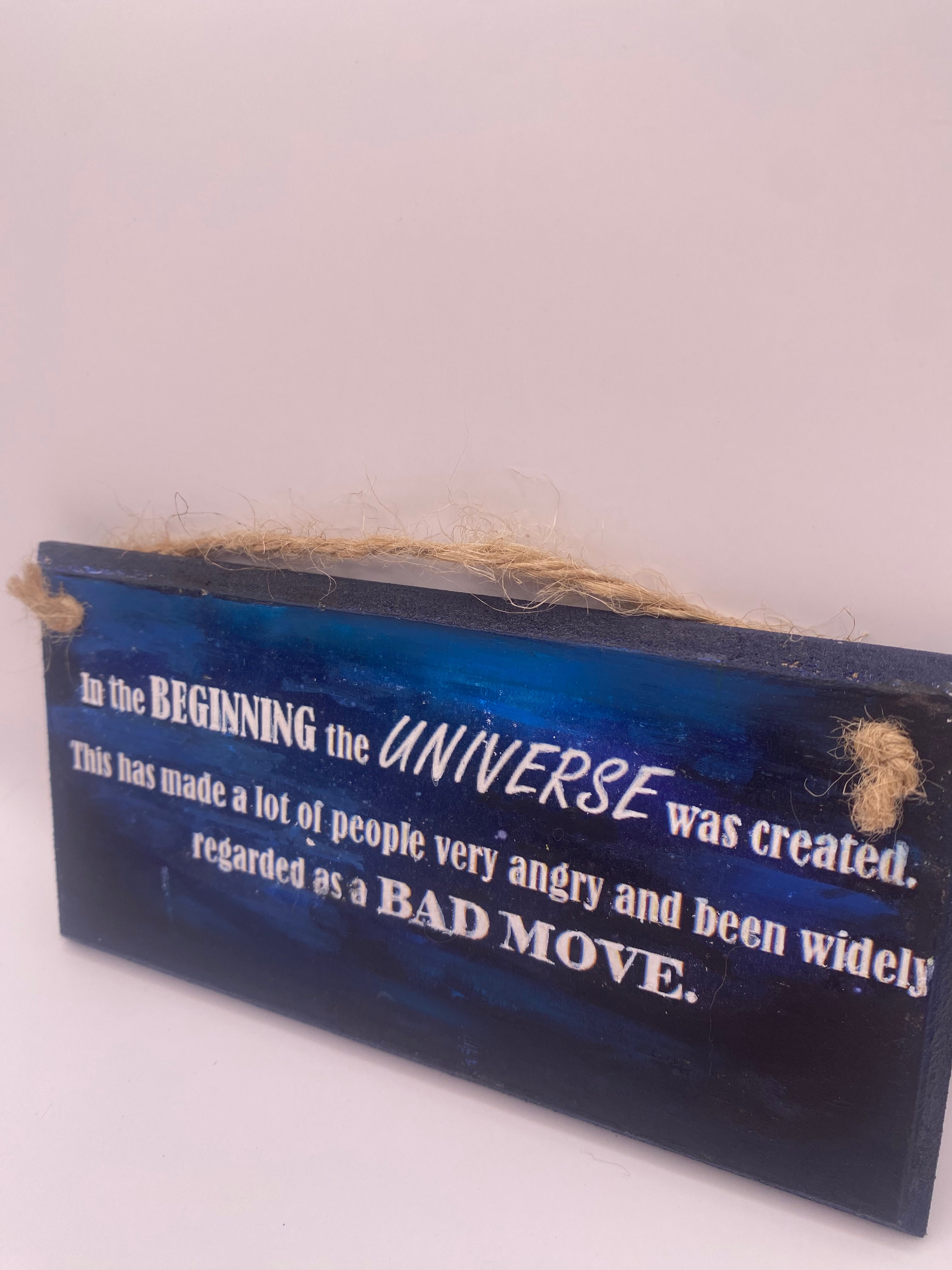 Hand‑Painted Wooden Plaque – “In the beginning the universe was created..." Douglas Adams inspired literary sign (6x3", 7x4”, 8x4”)